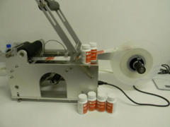 Masina etichetare recipiente cilindrice